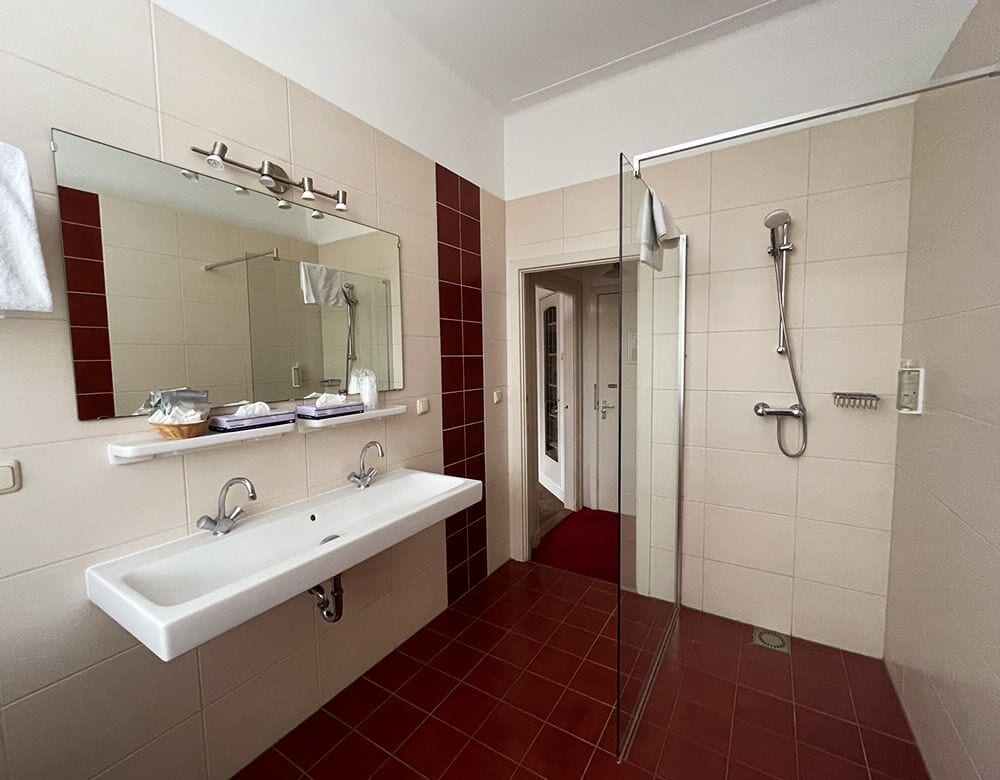 Family Suite: private bathroom with a double washbasin and walk-in shower