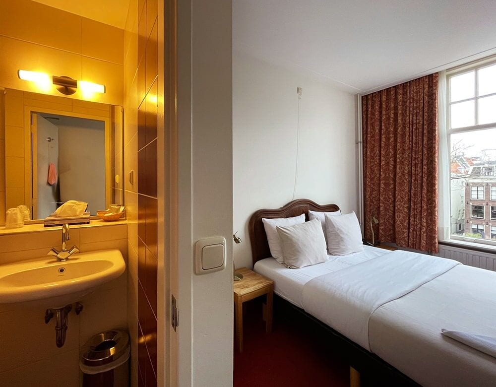 Small Double Room: the double bed and window, seen from the washbasin alcove
