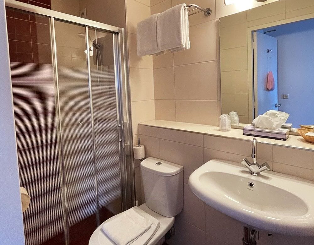 Small Double Room: private bathroom with a shower and washbasin